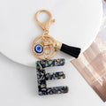 Shell-Chip Resin Letter Keychain with Evil Eye Charm and Tassel view 7