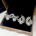 Crystal Bow Stud Earrings With Pearl Drops In Two Styles view 1