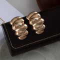 Polished Twisted Rib Wide Hoop Earrings in Two Finishes view 2
