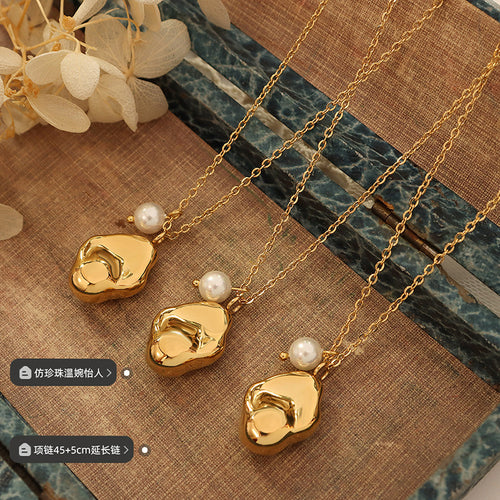Three gold organic pendants with pearls and length labels