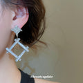 Silver Tone Crystal Open Diamond Drop Earrings with Polished Metal Details view 3