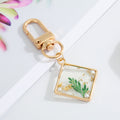 Gold Tone Pressed Flower Resin Clip Keychains in Four Shapes view 6