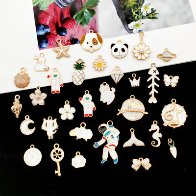 Colorful bear and moon charms arranged on a light background