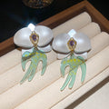 White Orchid Drop Earrings with Green Swallow Shaped Dangles view 6