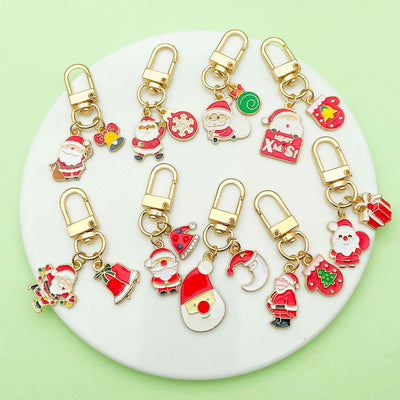 Image 1 showing a white plate topped with lots of christmas charms.