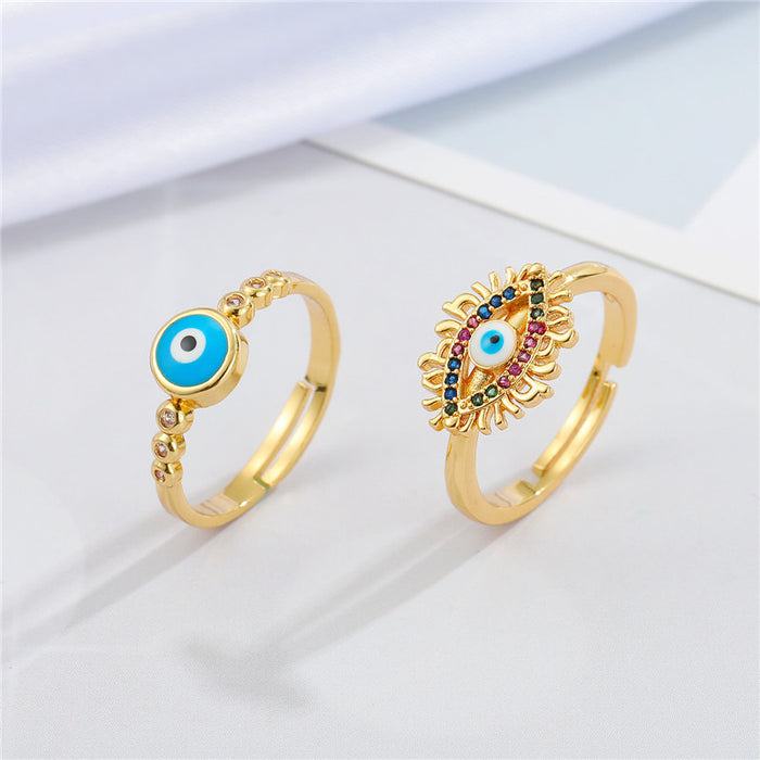 Gold Tone Multicolor Lash and Round Blue Evil Eye Adjustable Rings