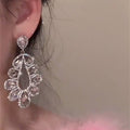 Silver Crystal Teardrop Cluster Stud Earrings with Polished Metal Details view 4