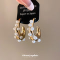 Gold Tone Chunky Hoop Earrings With White Pearl Border Accents view 1