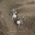 Silver Metal Ribbon Bow White Pearl Drop Earrings Pair view 3