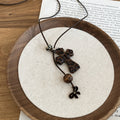 Brown Leopard Bow and Cross Pendant Necklace on Black Cord view 6