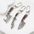 Silver Tone Faux Woodgrain Knife and Cleaver Clip Keychains view 1