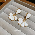 White Enamel Flower Drop Stud Earrings with Gold Tone Edges view 2