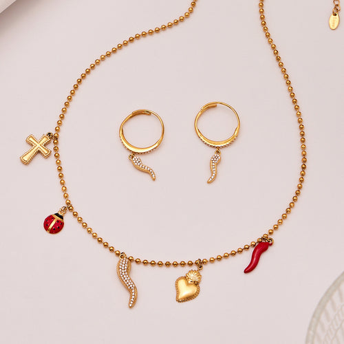 Gold ball chain necklace with chili cross ladybug charms and hoop earrings