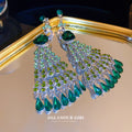 Green Crystal Peacock Chandelier Drop Earrings with Polished Metal Accents view 3