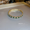 Gold Tone Open Cuff Bracelet With Green And Clear Crystal Rows view 2