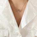 Open Bow Pendant Necklace Gold Steel Polished Metal view 7