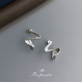 Silver-Tone Twisted Geometric Wave Line Metal Stud Earrings view 4