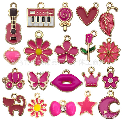 Colorful crown and butterfly charms arranged on a light background