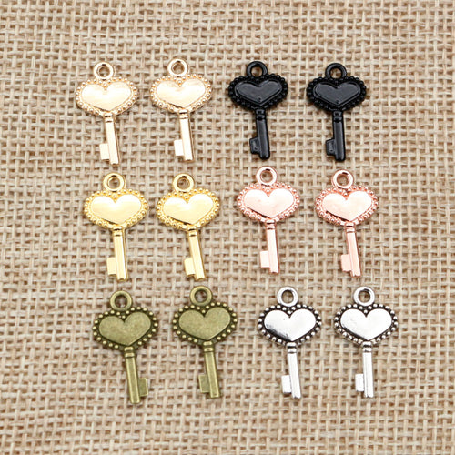 Finish comparison of heart bow key metal charms in eight finish options