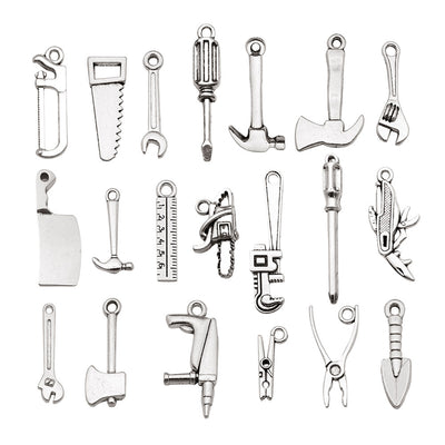 Antique silver assorted shape charms arranged on a light background