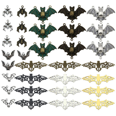 Matte gold-tone bat charms arranged on a light background
