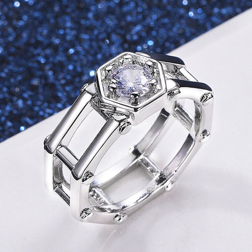 Angled silver geometric openwork ring showing layered band