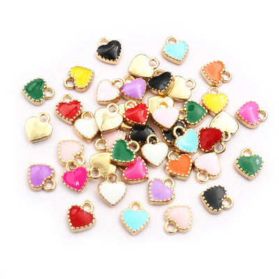 Tiny Colorful Heart Charms arranged in the pictured color and finish options