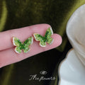 Gold Tone Green Faceted Butterfly Clear Stone Edge Stud Earrings view 1