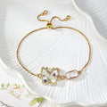 Gold Tone Pressed Flower Butterfly Slider Bracelets in Six Designs view 3