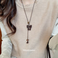 Brown Leopard Bow and Cross Pendant Necklace on Black Cord view 3