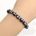Black Skull Bead Stretch Bracelet White Eye Accents view 3