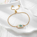 Gold Tone Peacock Feather Evil Eye Slider Bracelets in Nine Shapes view 10