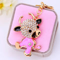 Jeweled Zodiac Cow Keychains in Pink and Red Pictured Colors view 3