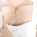 Gold Tone Three Stone Vertical Baguette Pendant Necklace view 3