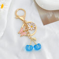 Cherry Charm Keychain with Enamel Butterfly and Daisy Flower Pendant view 9