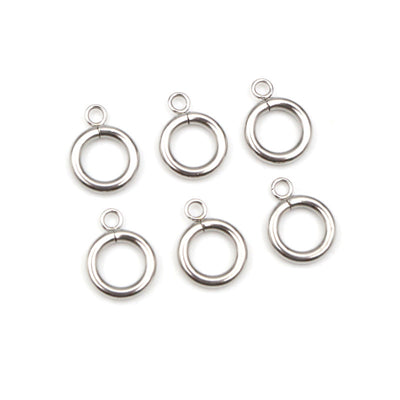 Overview of polished silver tone thick round ring connector charms arranged on white