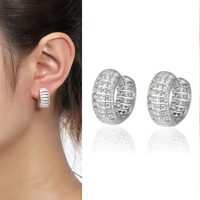 Pavé Wide Huggie Hoop Earrings in Gold and Silver Tones shown in product close-up