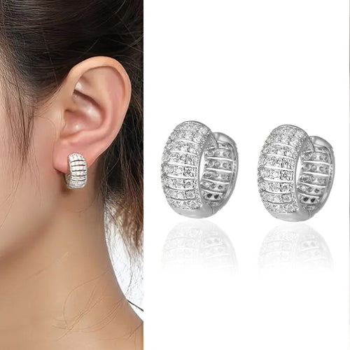Pavé Wide Huggie Hoop Earrings in Gold and Silver Tones shown in product close-up