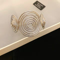 Spiral Disk And Organic Loop Open Cuffs In Gold Or Silver Tone view 9