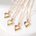 Gold Tone Puffy Heart Pendant Necklaces with Evil Eye Accents view 1