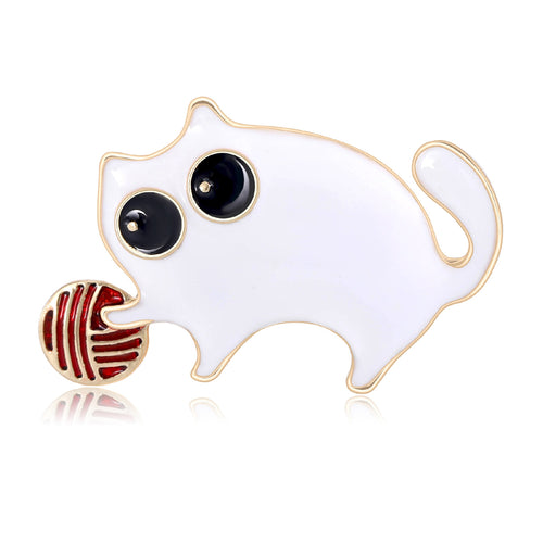 Angled view of the enamel cat with yarn brooch