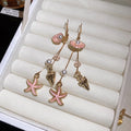 Gold Tone Coastal Charm Hook Earrings in Three Colors view 8