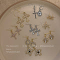 Gold-Tone Pavé Cross Stud And Pearl Cross Drop Earrings view 2