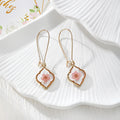 Gold Tone Quatrefoil Pressed Flower Drop Earrings in Six Designs view 5