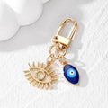 Gold Tone Open Lash Eye and Blue Evil Eye Clip Keychains view 8
