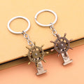 Metal Ship Wheel Keychain With Anchor Detail In Two Finishes view 2