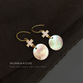 Gold Tone Clear Stone Cross And Iridescent Shell Disc Hook Earrings view 4