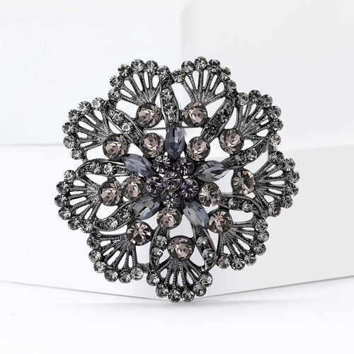 Angled view showing the openwork flower brooch surface