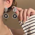 Clear Stone Top Black Round Silver Tone Medallion Earrings view 1