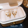 Gold Tone Butterfly Stud Earrings with Crystal Wings view 2